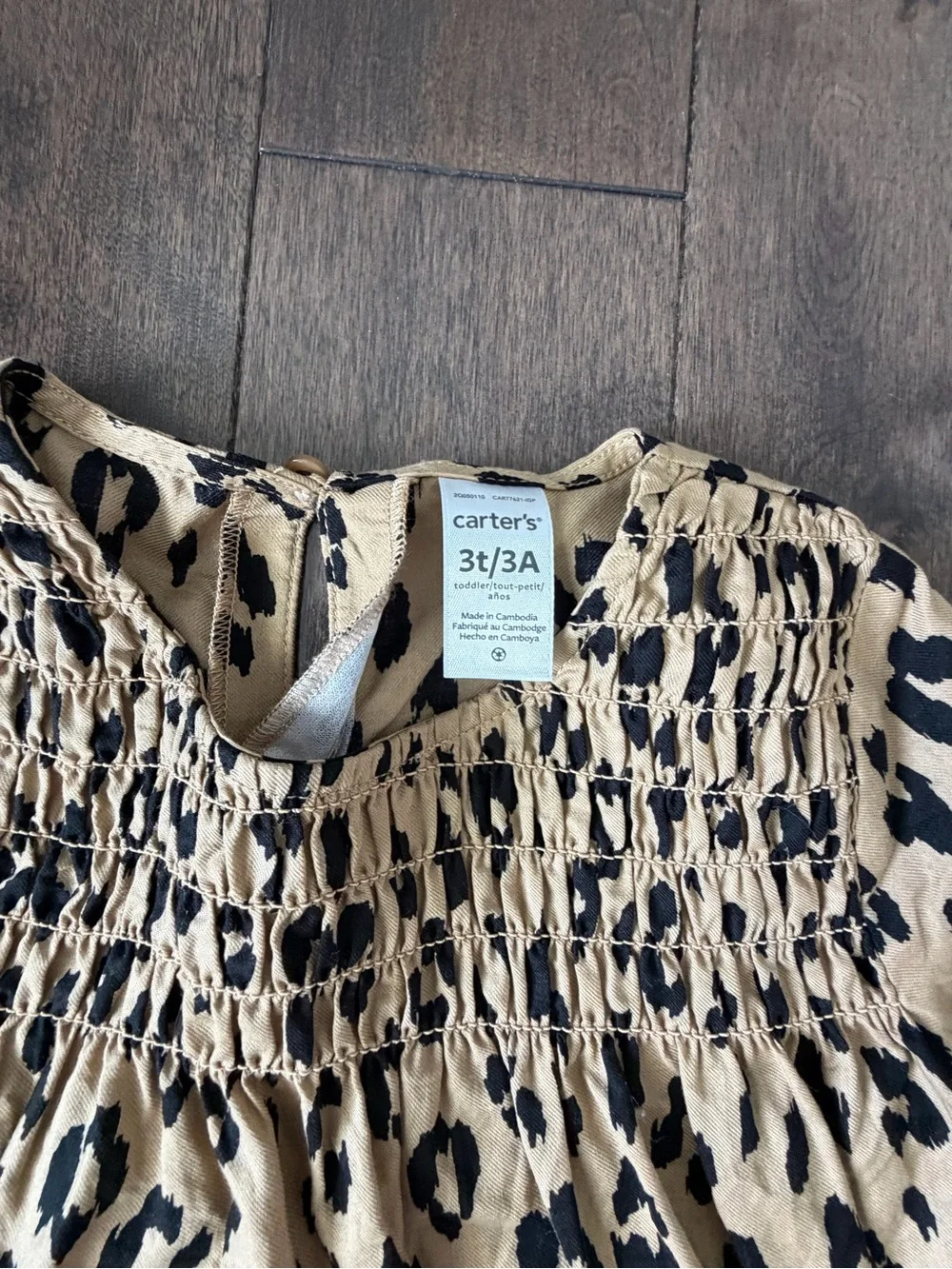 Toddler Girl Carter's Leopard Print Smocked Top with black leggings